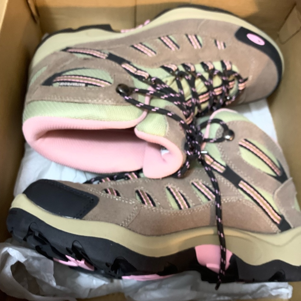 Hi-tech women’s hiking boots. New still in box, size 8.5.